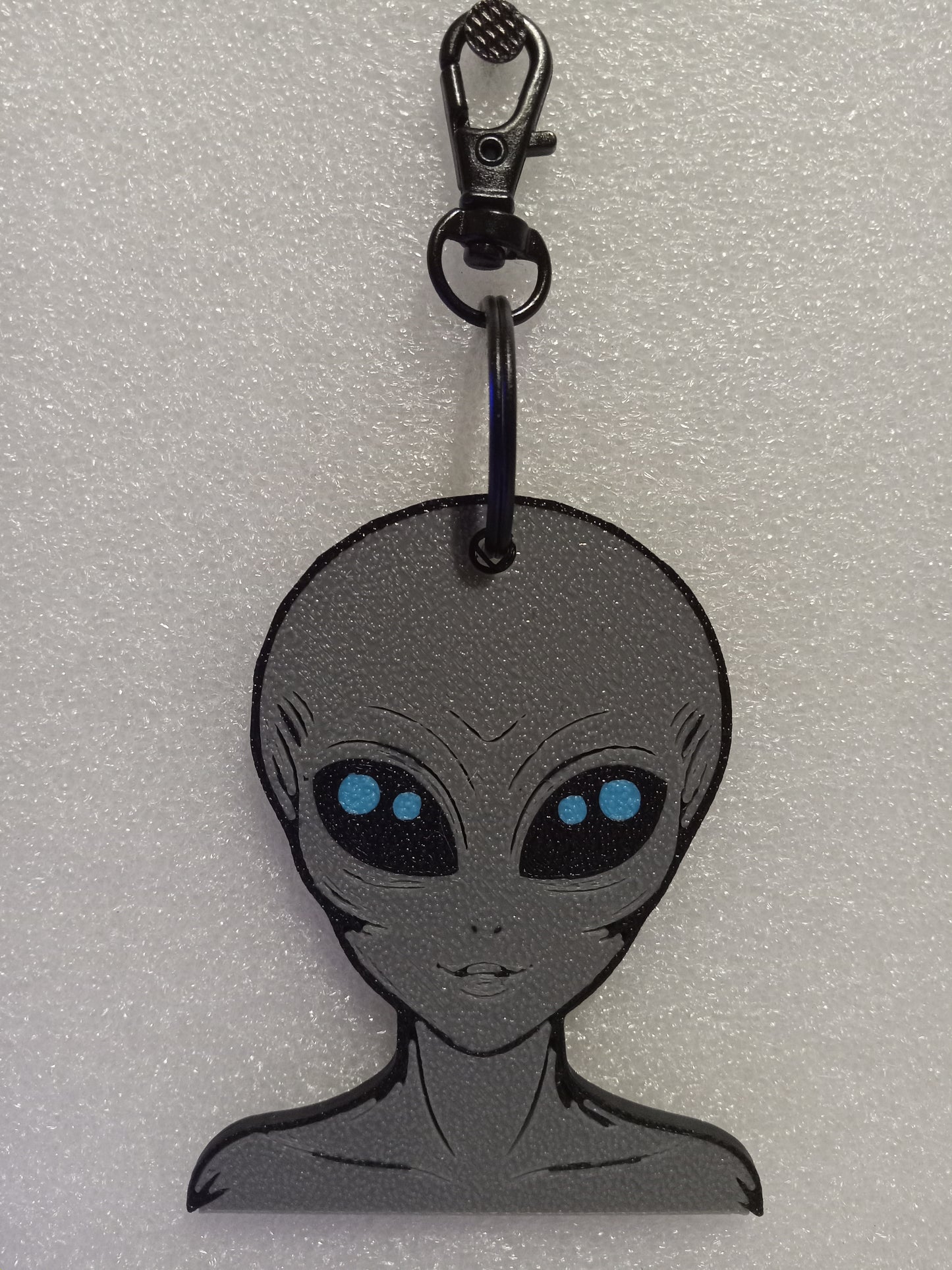 Galactic Grey/Blue Alien Keychain: A Cosmic Ambassador