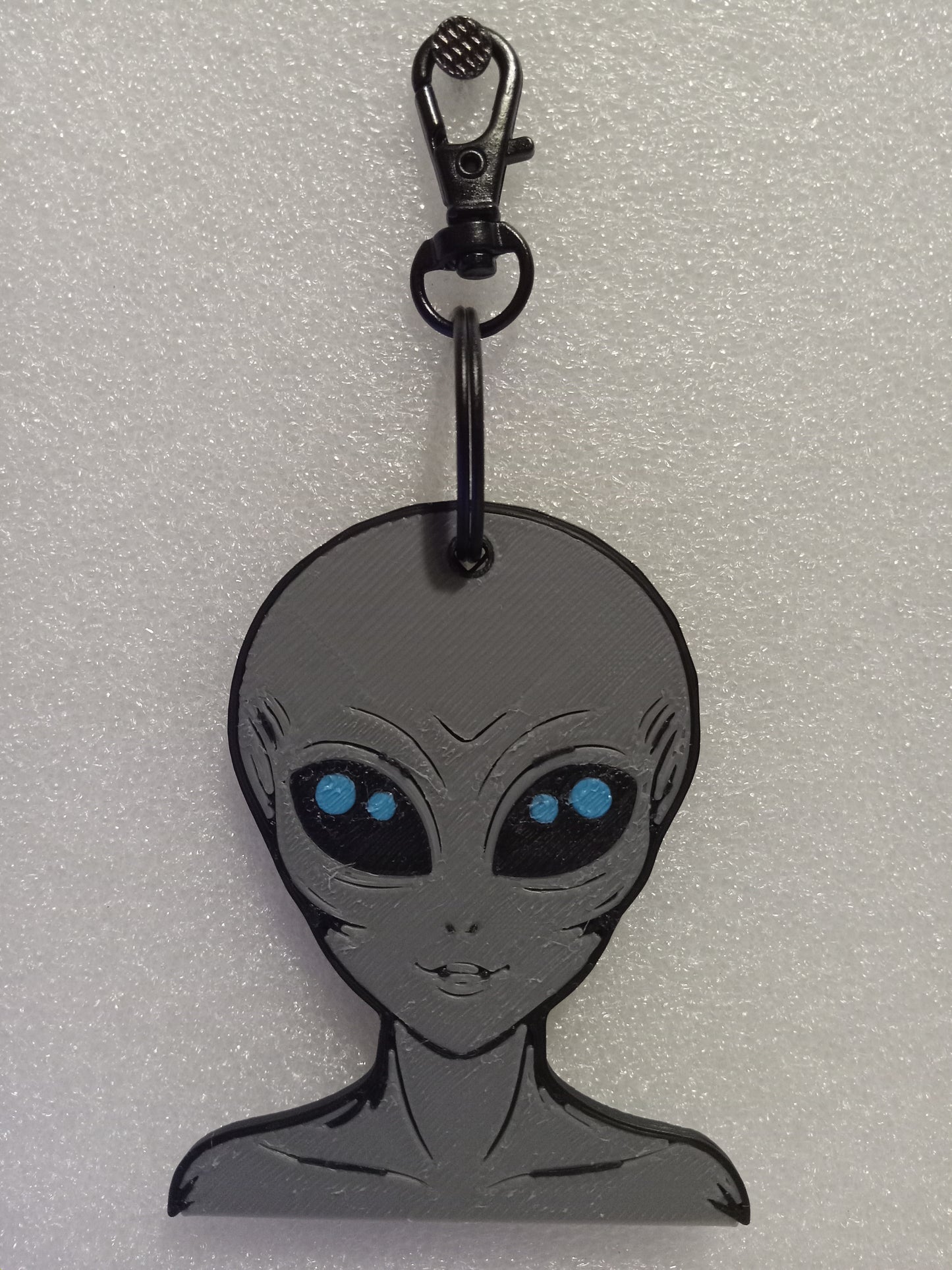 Galactic Grey/Blue Alien Keychain: A Cosmic Ambassador