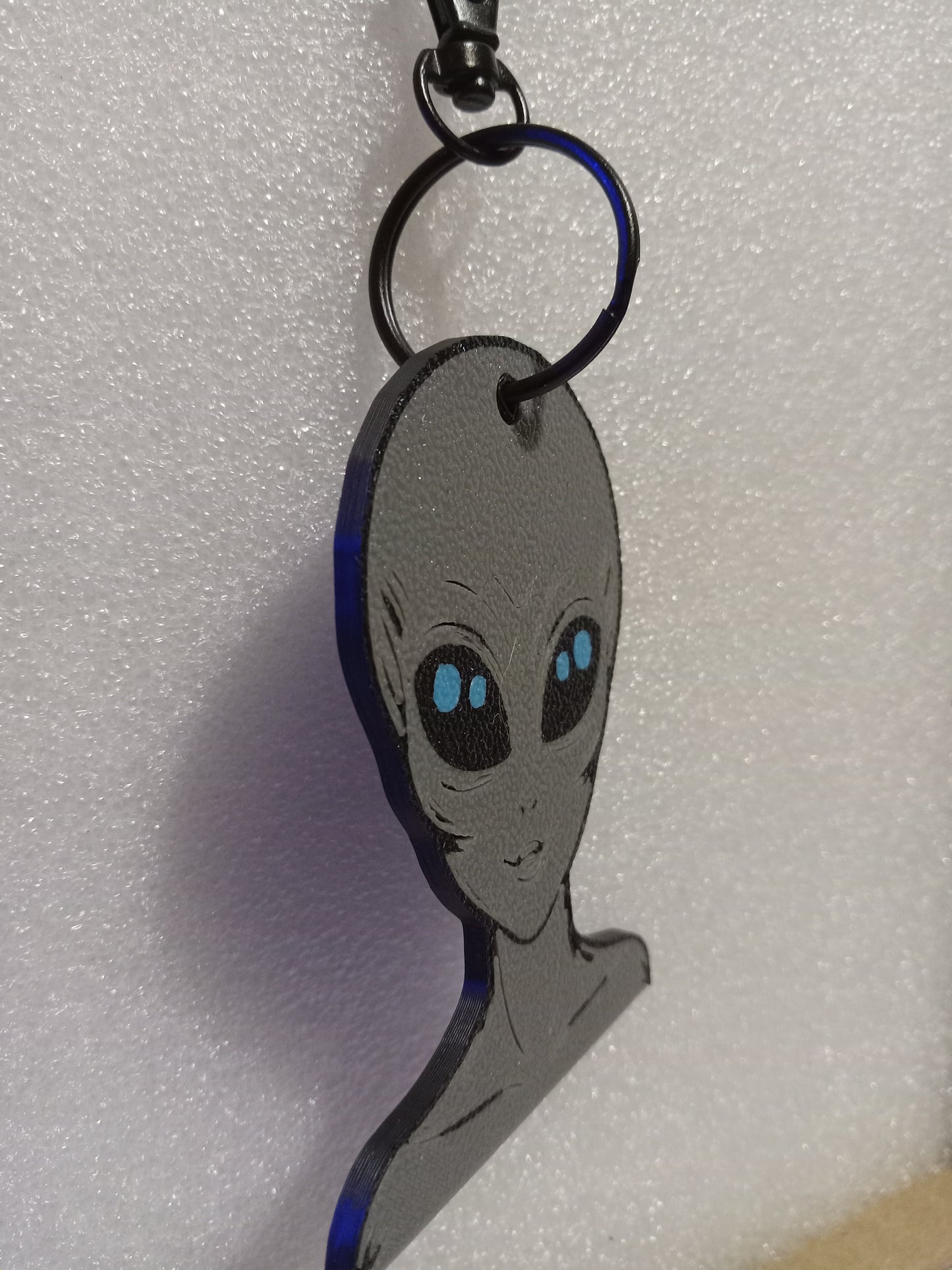 Galactic Grey/Blue Alien Keychain: A Cosmic Ambassador