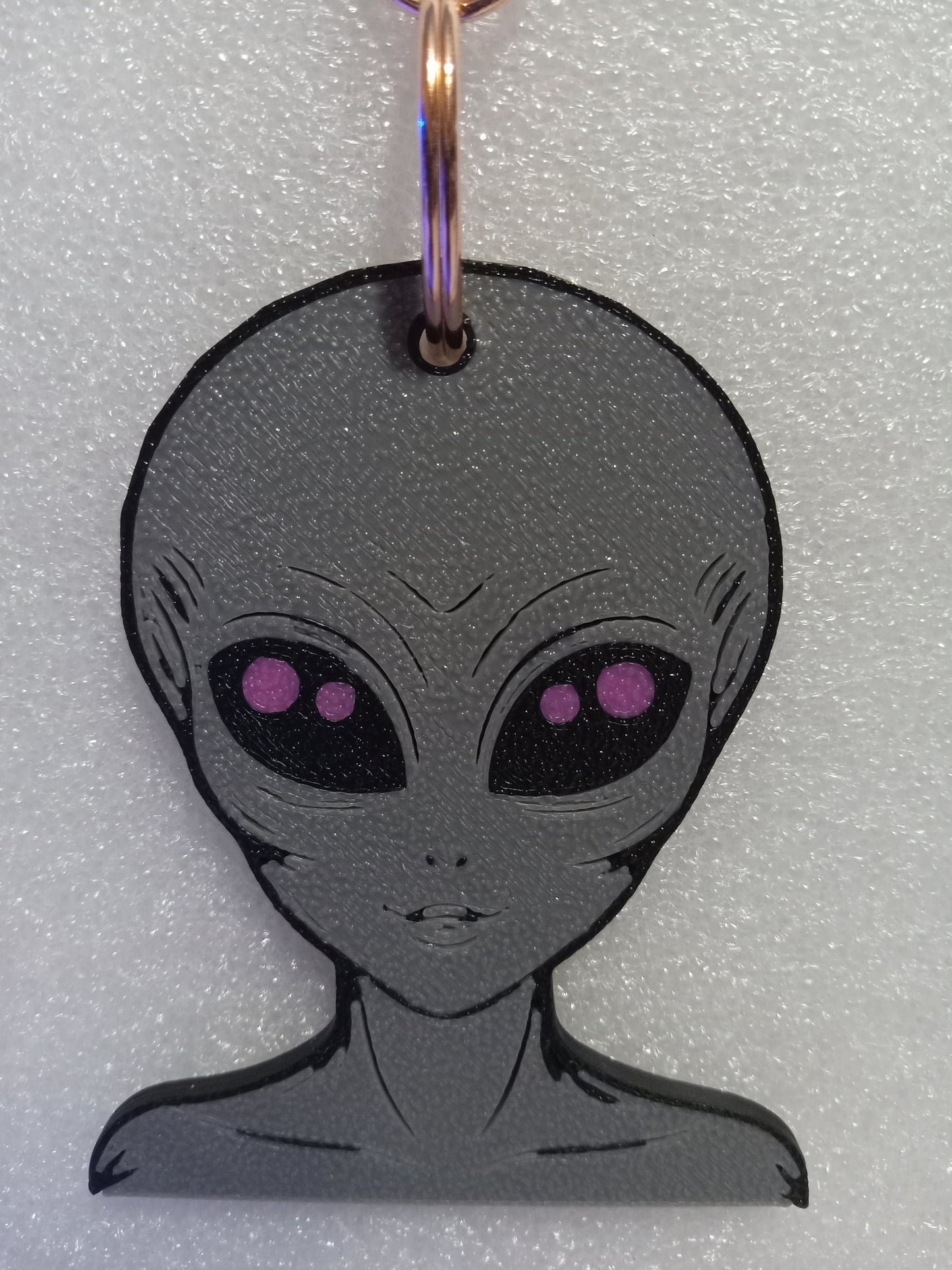 Galactic Grey/Pink Alien Keychain: A Cosmic Ambassador
