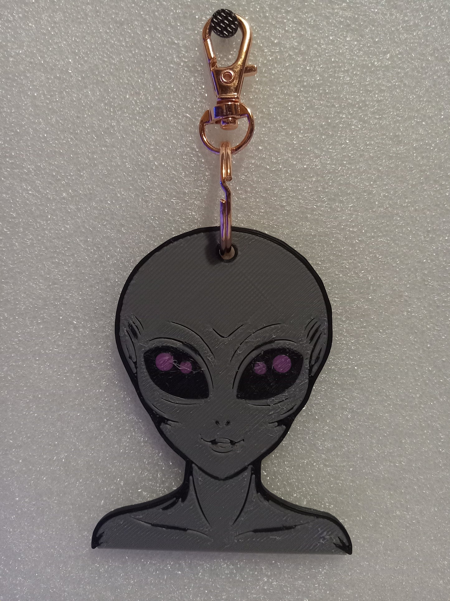 Galactic Grey/Pink Alien Keychain: A Cosmic Ambassador